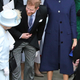 Queen Elizabeth II speaks with the Duke and Duchess of Sussex outside St George’s Chapel in Windsor Castle, following the wedding of Princess Eugenie to Jack Brooksbank on Oct. 12, 2018 in Windsor, England.